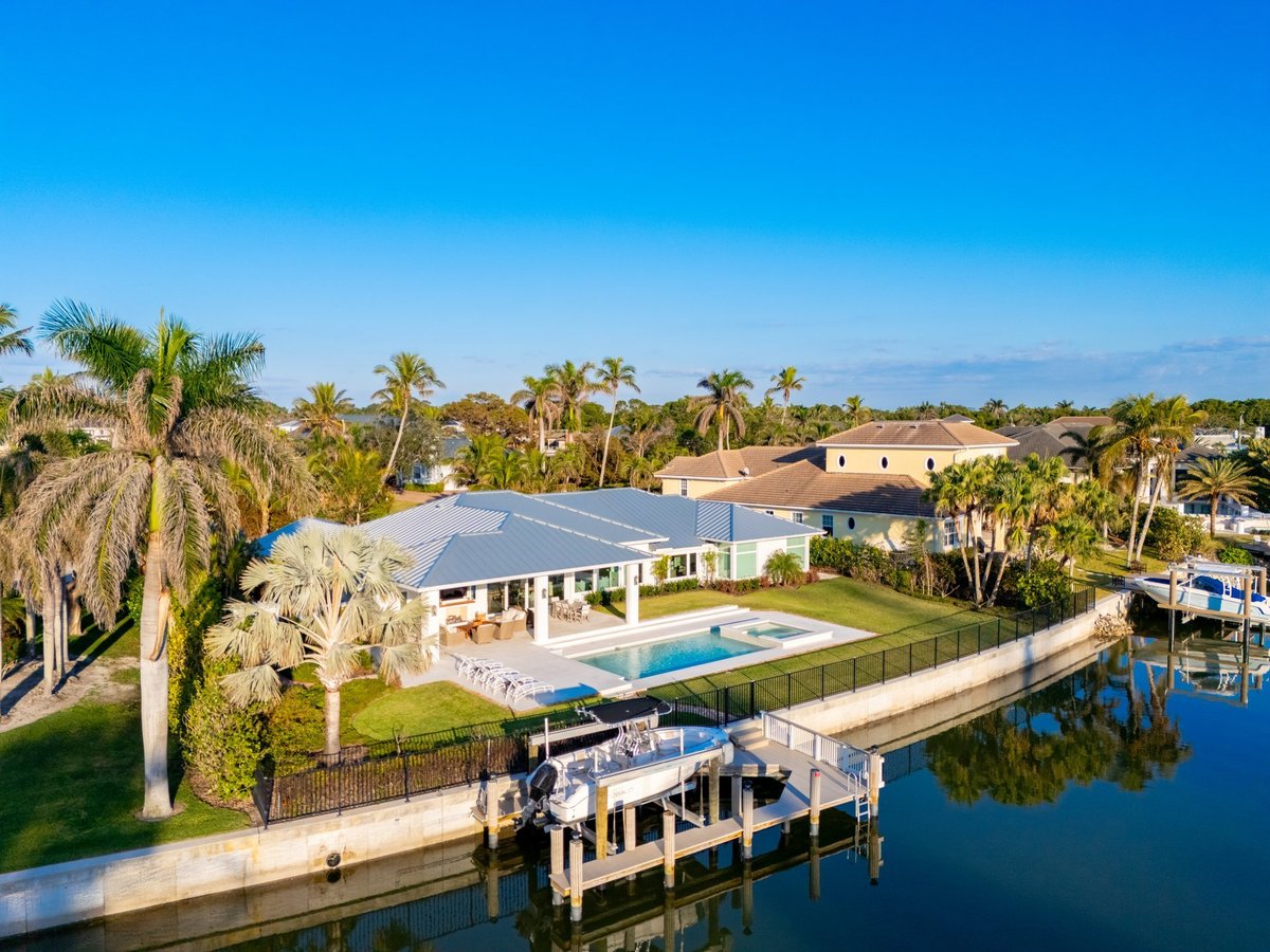 Naples Florida aerial photo of luxury waterfront mansion homes with dock