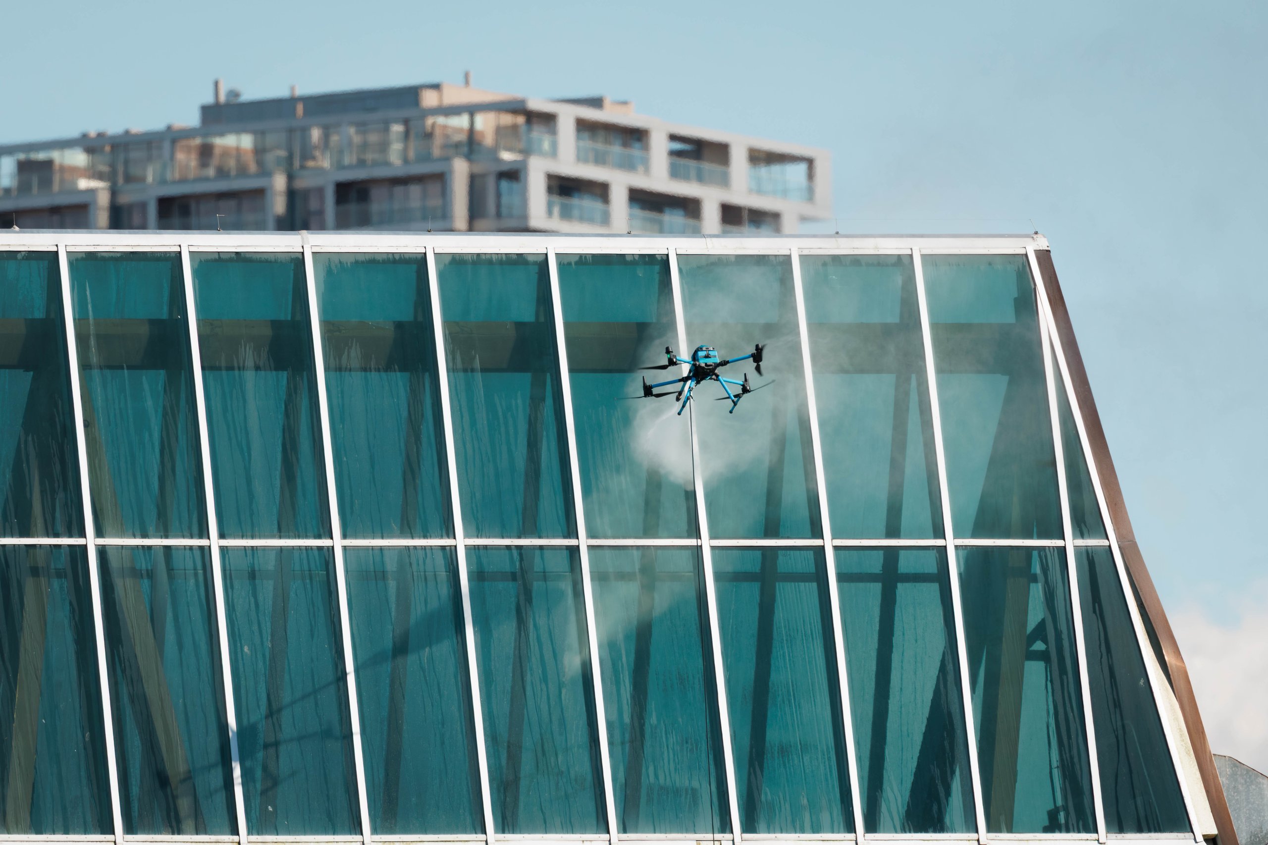 Drone cleaning solar panels high rise buildings